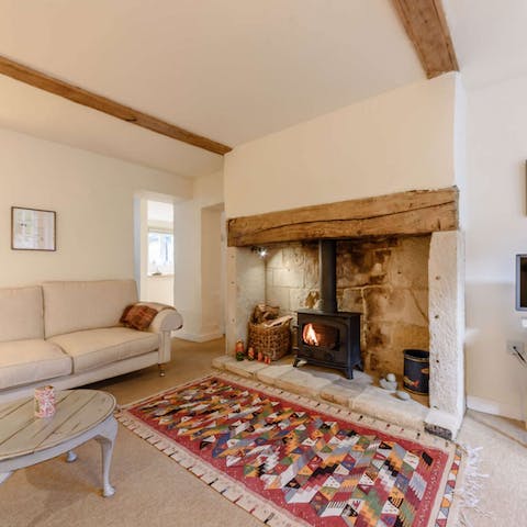 Listen to the wood-burning stove crackle and pop as you get cosy on the sofa