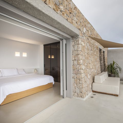 Wake up in the double bedroom with access to the pool and terrace