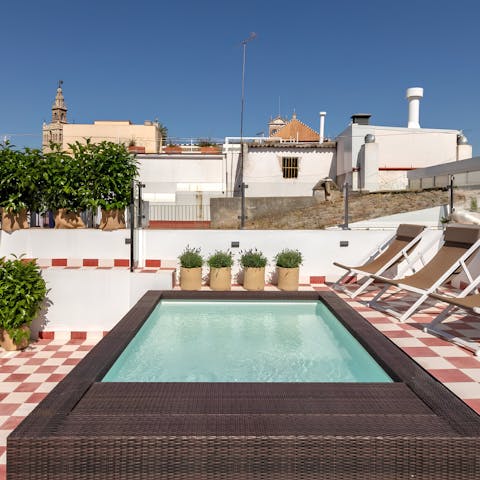 Enjoy a cooling dip in the communal rooftop pool