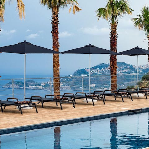 Stretch out on the loungers after a dip in the saltwater pool