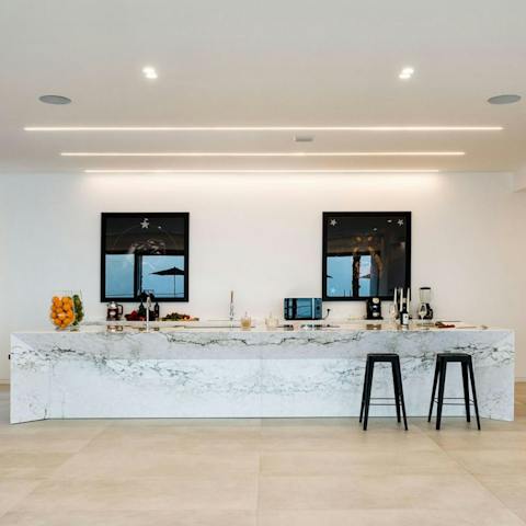 Enjoy a chef-prepared dinner in the sleek kitchen