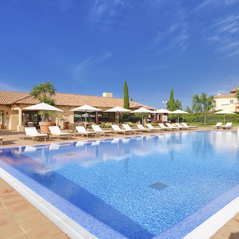 Take cooling dips in the enormous shared pool in between sunbathing sessions