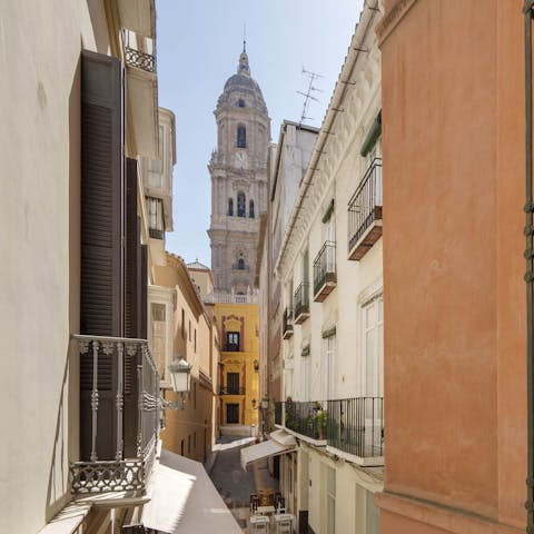 Step out onto the Juliet balcony during sunset and admire the stunning view of The Cathedral of Málaga