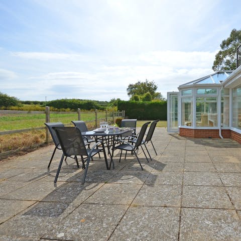 Dine al fresco with vast views over the fields