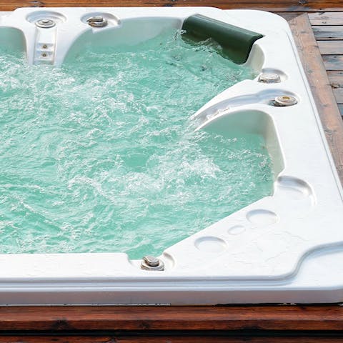 Treat yourself to a relaxing soak in the hot tub