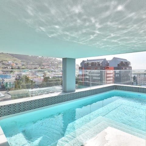 Soak up vistas of Signal Hill from the communal pool