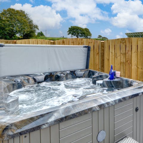 Sip bubbly in the outdoor hot tub