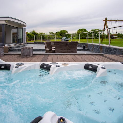 Sit back and enjoy the eight-person hot tub in the garden