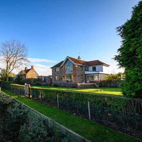 Stroll through the colourful garden and the fields beyond 