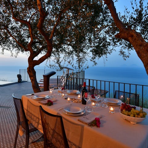 Tuck into a Sicilian feast at the outdoor table, watching the sunset and sharing bottles of wine