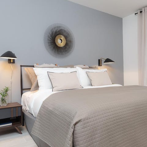 Look forward to an early night in the soothing bedroom with quality linens