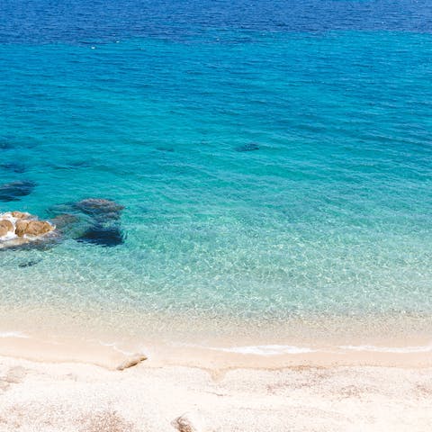 Spend days swimming the crystal clear waters of Ftelia Beach, just 500m away