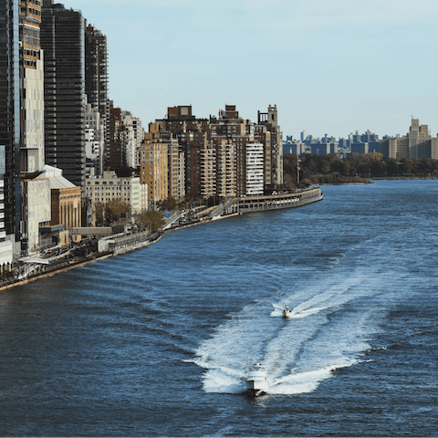 Go for a walk along the East River, just one block away
