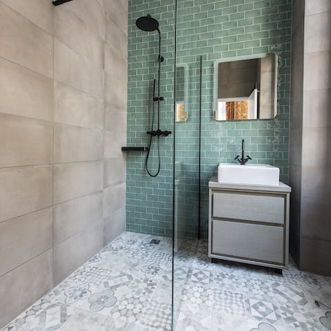 Start mornings with a luxurious soak under the bathroom's rainfall shower
