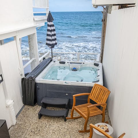 Watch the waves roll in from the bubbles of your hot tub