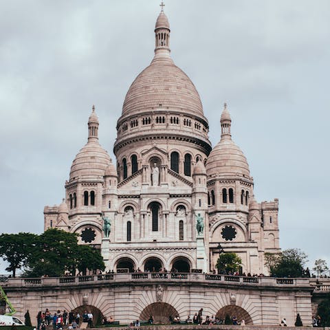 Visit the beautiful Sacré-Cœur Basilica, an eight-minute walk away