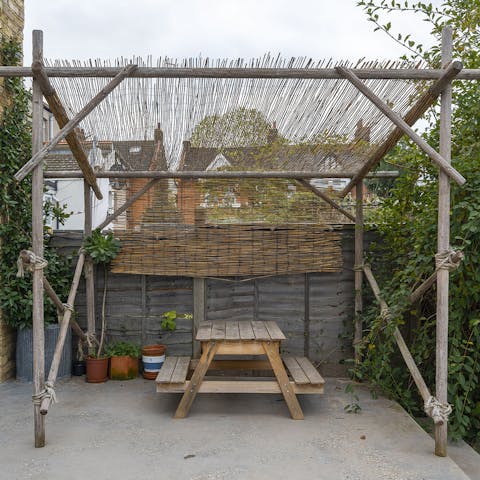 Dine alfresco at the picnic bench in the garden