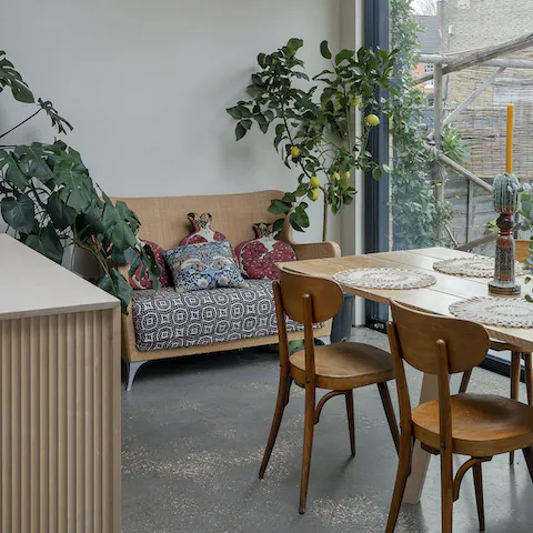 Relax in serene spaces, with pops of plant life in each room