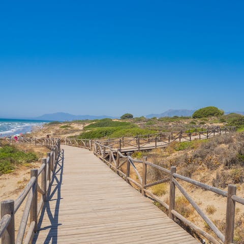 Stroll through the breathtaking Dunas de Artola nature reserve en-route to the beach