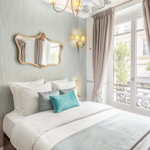 Wake up in a fairytale bedroom, with views of the Parisian streets