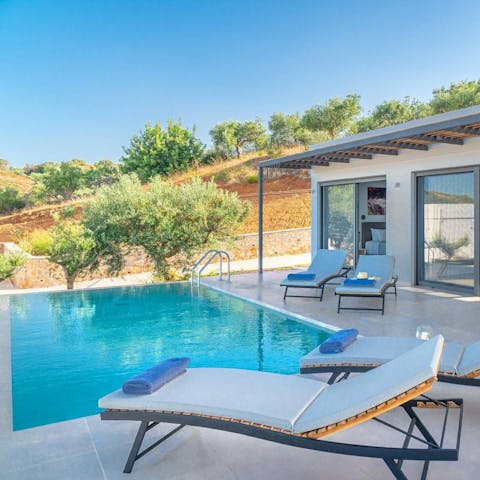 Float about in the private pool after snoozing on a lounger