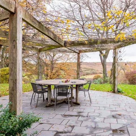 Dine alfresco on your leafy patio with lovely views of the rambling fields