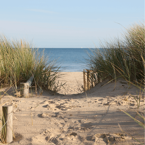 Visit the white sand Avon Beach, less than a thirty-minute drive away