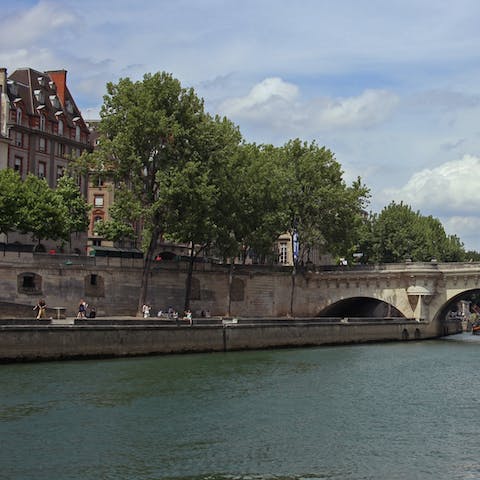 Enjoy a scenic stroll along the Seine, admiring the city's beautiful architecture 