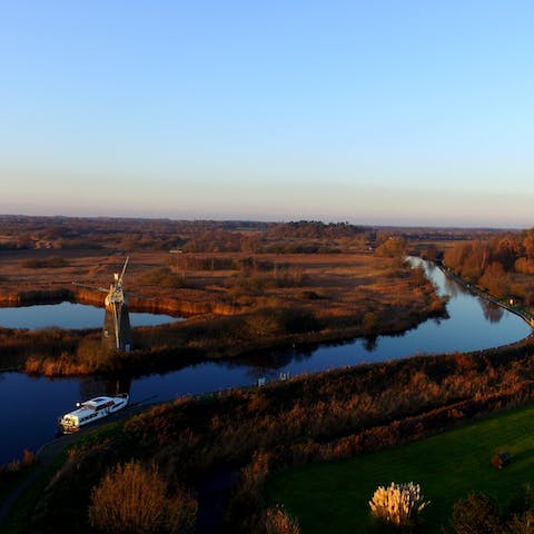 Hire a boat and spend a day cruising through the spectacular Norfolk Broads