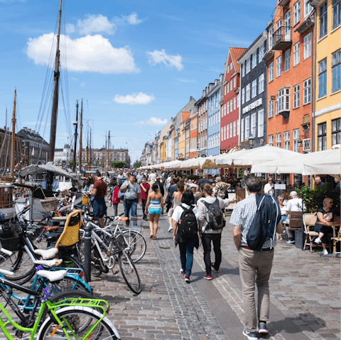 Wander down to Nyhavn to sample local dishes next to the quaint harbour
