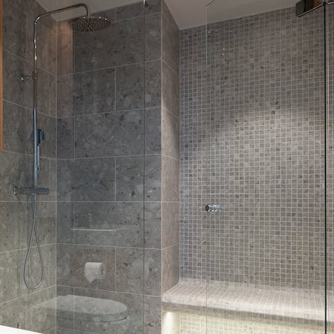 Feel anew in the master bathroom's steam and sauna shower