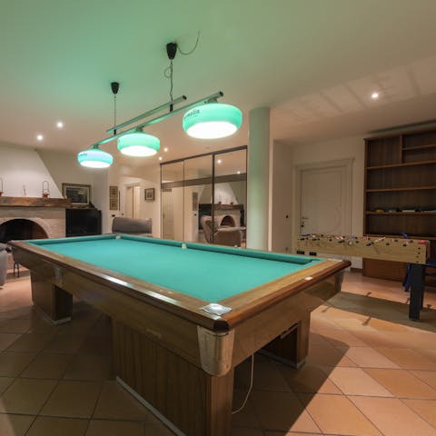 Enjoy a game of pool or table football in the basement games room
