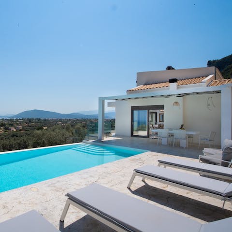 Relax on the sun loungers under the hot Greek sun