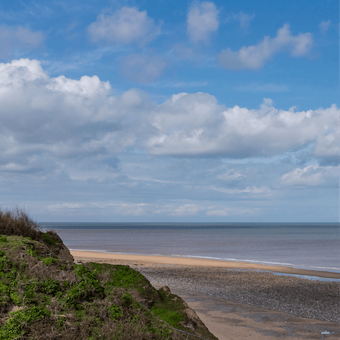 Go for a relaxing stroll along Cromer Beach, a seven-minute walk from home