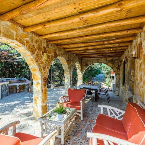 Pour yourself a glass of wine and relax on the shaded terrace