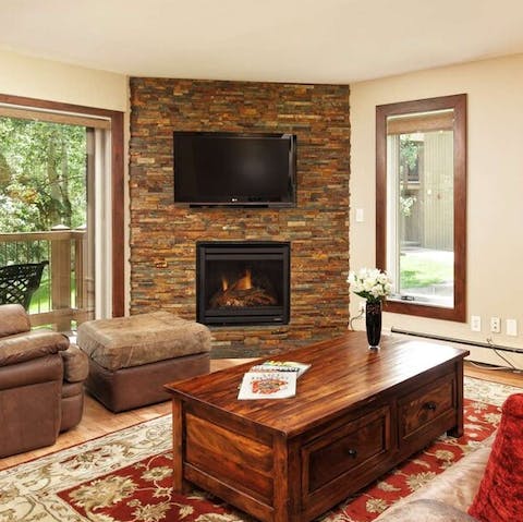 Relax around the living room’s gas fireplace