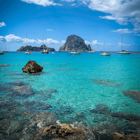 Explore the stunning south coast of Ibiza, with crystal-clear waters and dramatic rocky outcrops