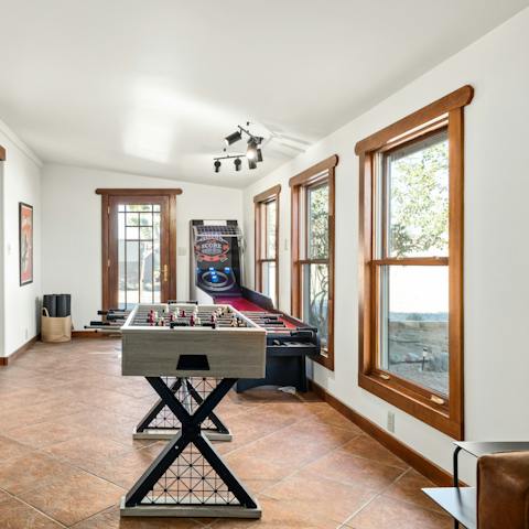 Challenge the household to a game of table football or ski ball in the games room