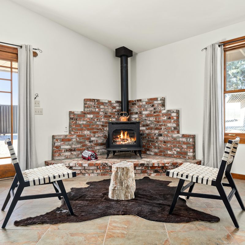 Gather around the wood burner at night sharing stories from your day exploring