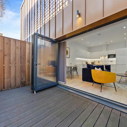 Slide open the bi-fold doors and make the most of your private patio