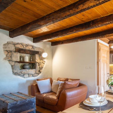 Feel the history of the home with wooden ceilings and exposed stone