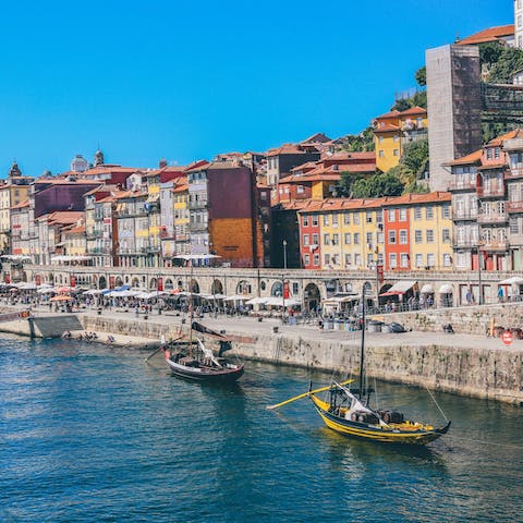 Take a stroll along the colourful harbour and watch the boats cruise across the water