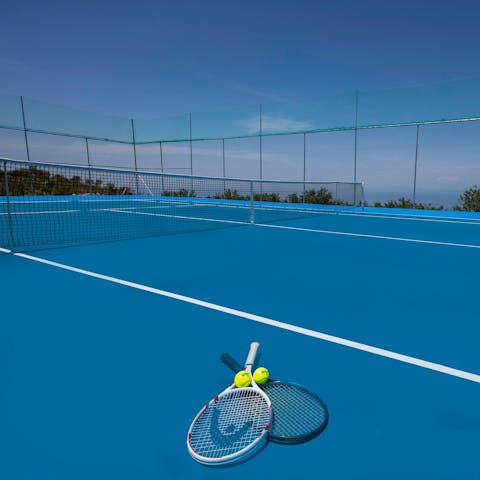 Show off your backhand on the shared tennis court