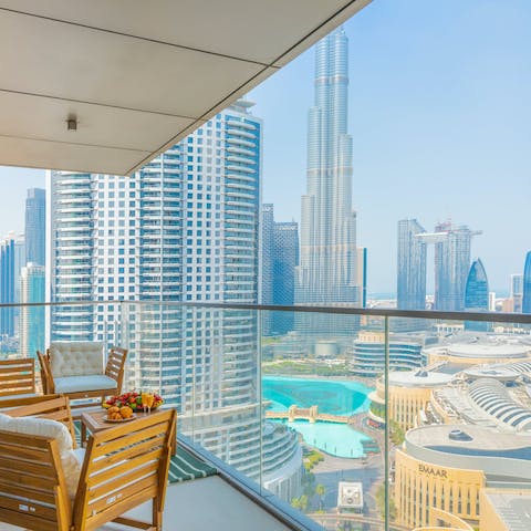 Take morning coffee on the balcony looking out at the Burj Khalifa