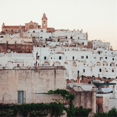 Lose yourself in the labyrinthine backstreets of Ostuni, around twenty minutes away 