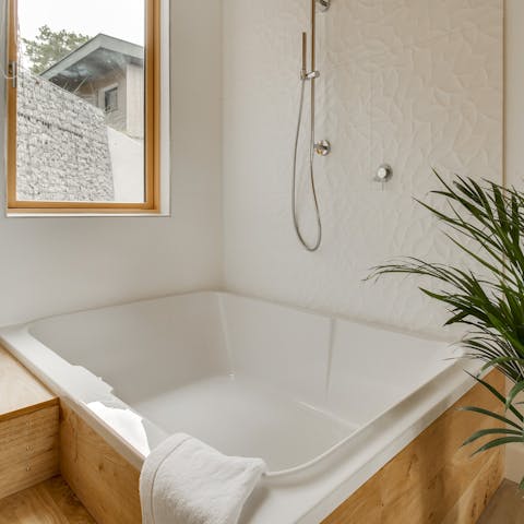 Take a relaxing soak in the large spa tub 