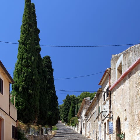 Explore the charming streets of old town Pollença – less than a ten–minute drive away
