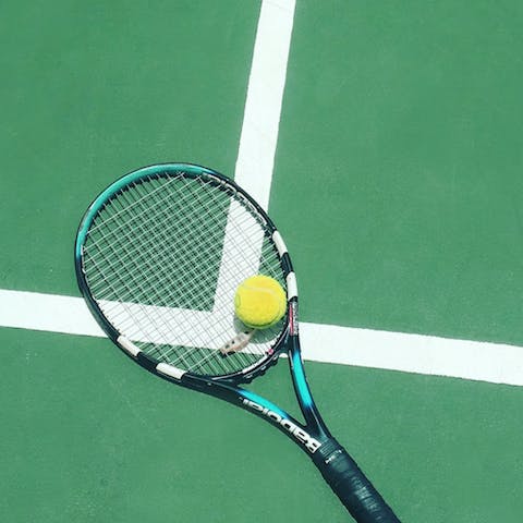 Play a few games of tennis on any of the six courts