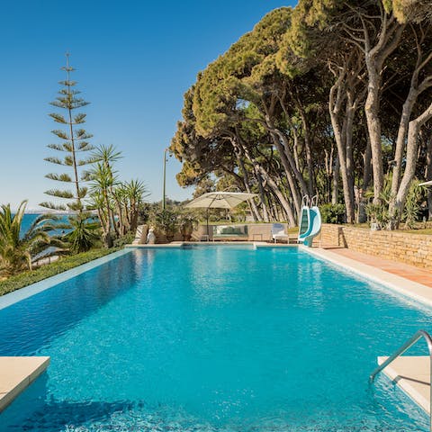Float under clear skies in one of the private pools