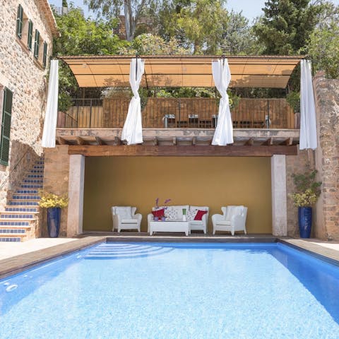 Seek out a shaded spot in the covered poolside loggia